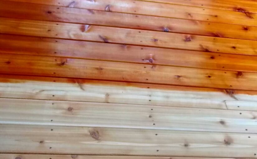 Image of cedar deck boards half stained with cedar stain