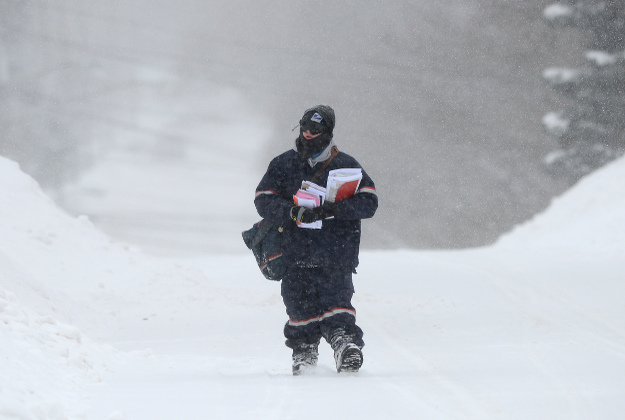 Image of postal carrier in snowstorm, Contact Handy Al, your quality Toronto Handyman