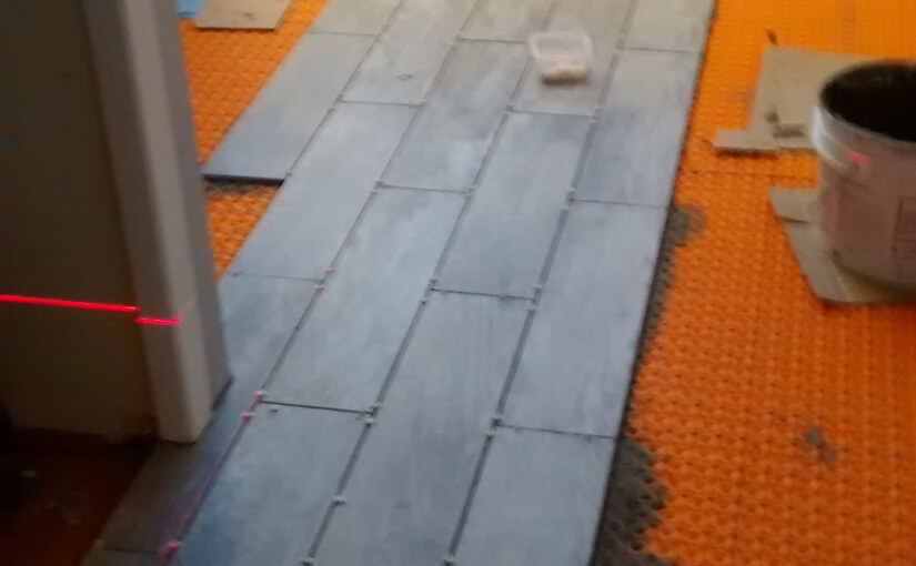 Image of tiling in progress using Ditra Heat radiant floor heat